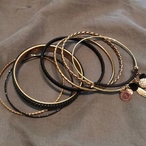 Black and gold bracelet with charms